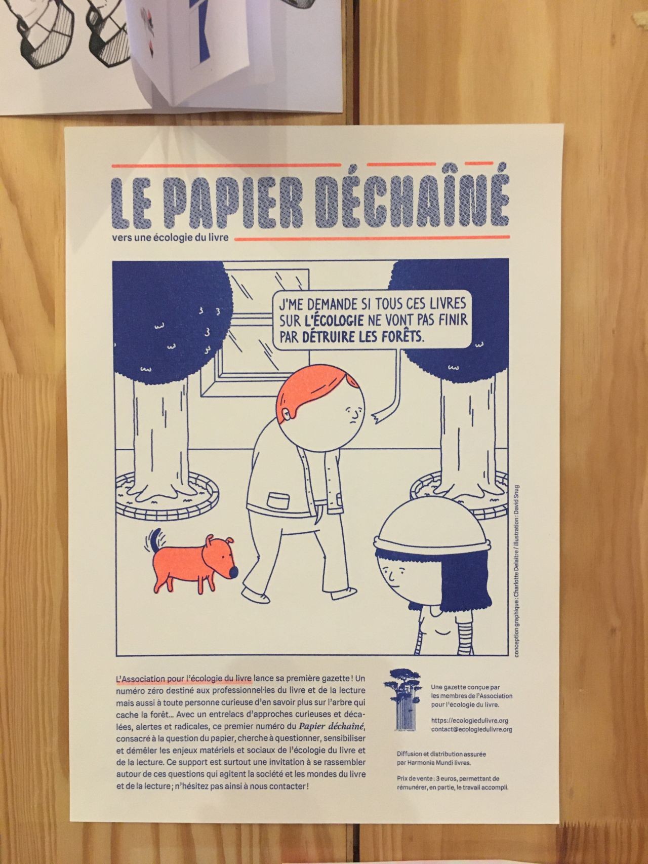 Une affichette de présentation de la gazette, avec un personnage se demandant si tous ces livres sur l'écologie ne vont pas finir par détruire les forêts (et un petit chien content)